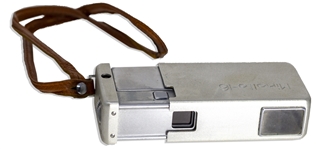 Moe Howard's Handwritten Luggage Tag & His Minolta-16 Miniature Camera, in Brown Leather Case -- Leather Tag Measures 3.75'' x 2'', Cased Camera Measures 4'' x 2'' -- Very Good